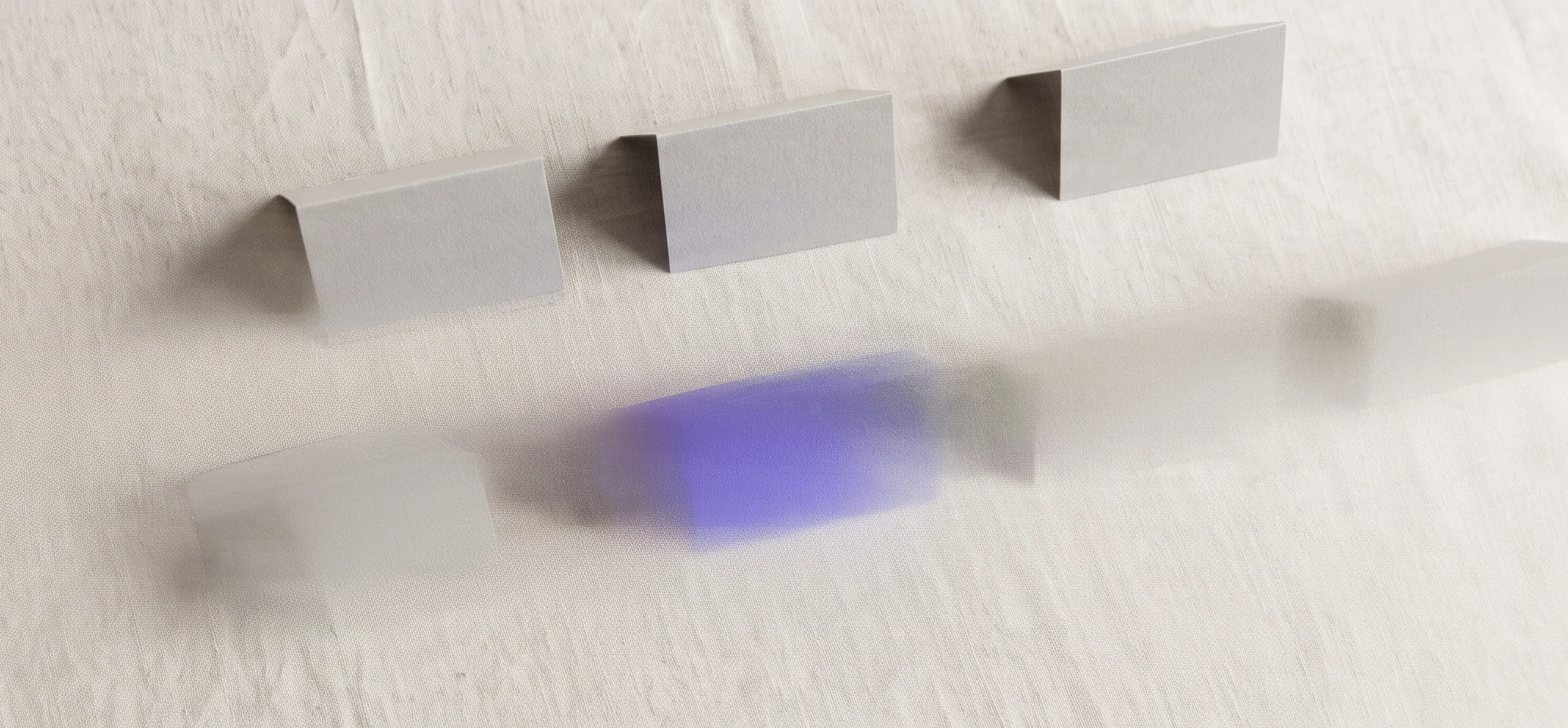 A purple folded card standing out among grey folded cards, illustrating above the fold design